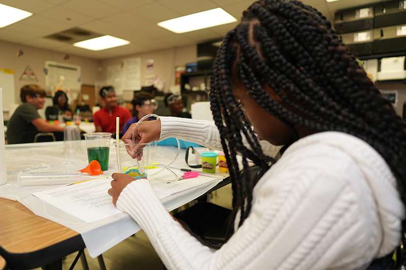 Students building reservoirs