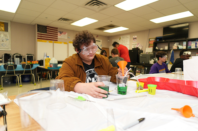 Students building reservoirs