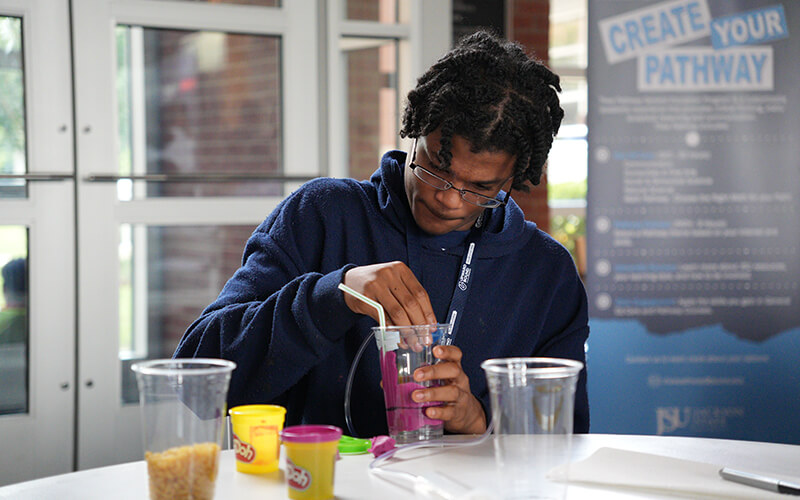 Students building reservoirs