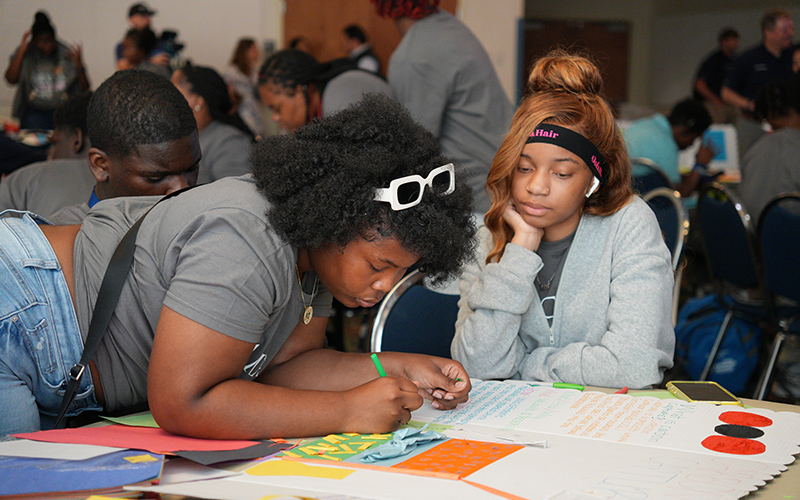 Students working on poster presentations