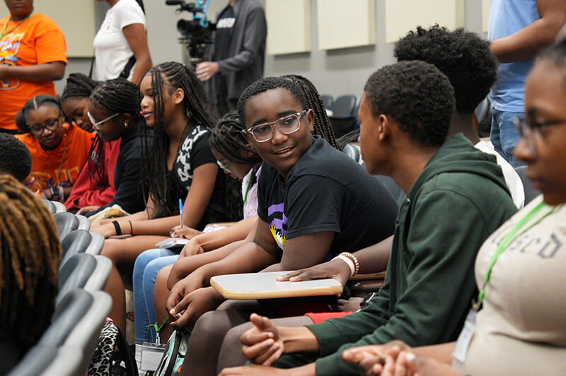 Students listening to presentations