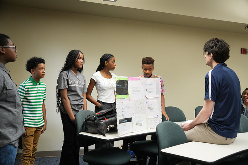 Students giving presentations