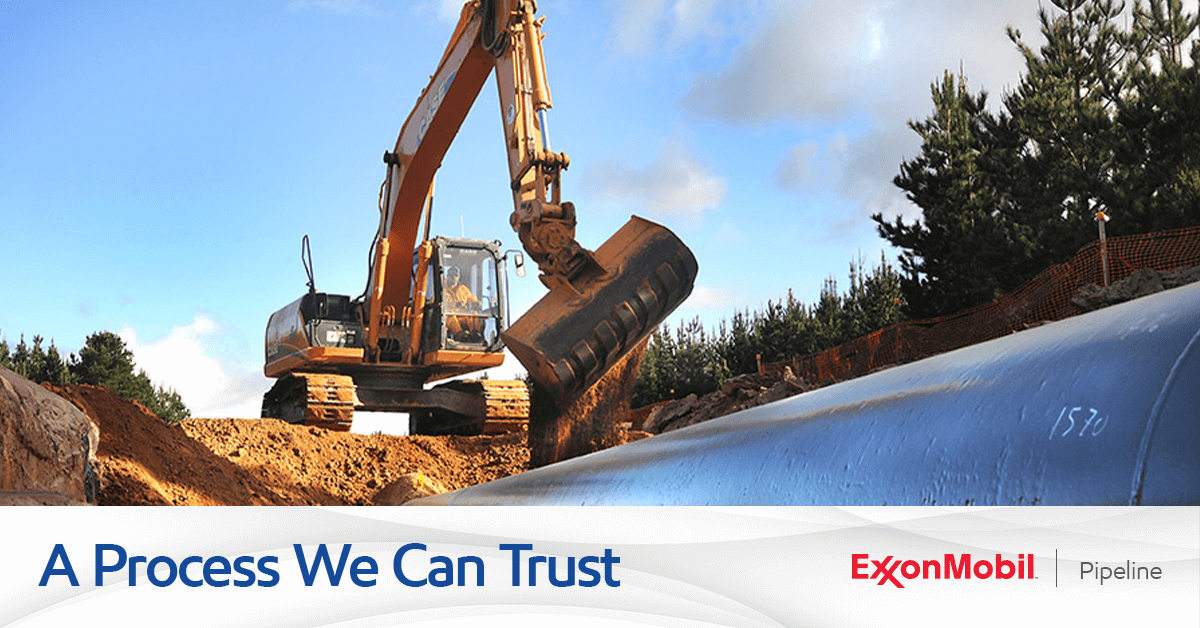 Bulldozer digging into pipeline