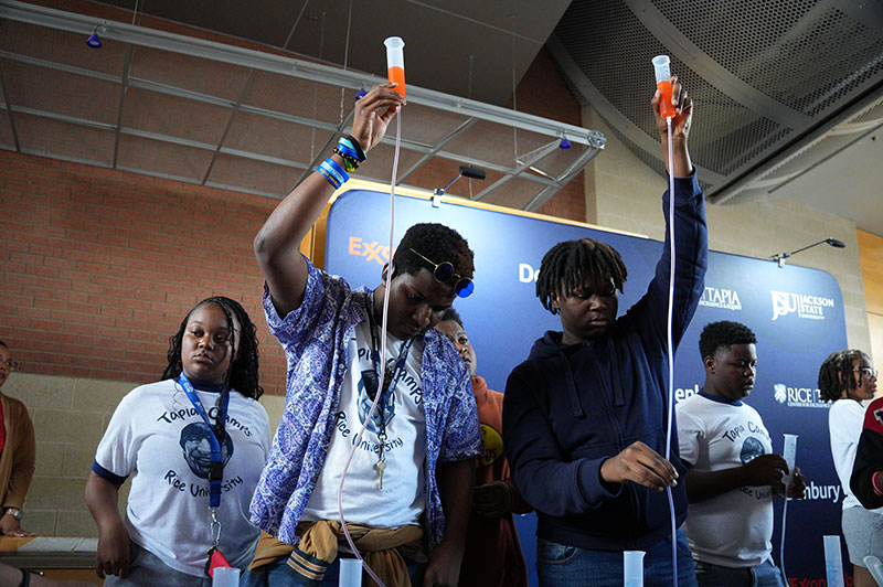 Students doing science experiments at STEM camp