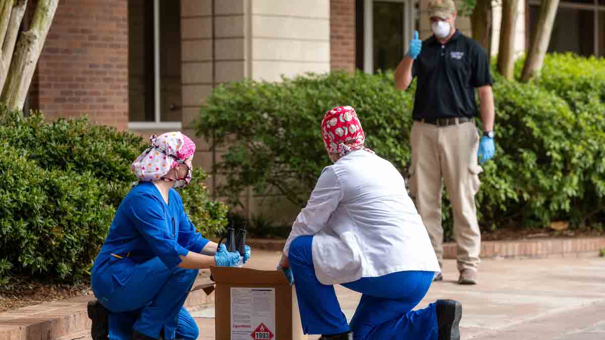 Ryan Beissinger maintains social distancing during a delivery at Baton Rouge General Hospital